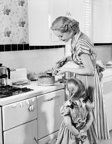 Mom preparing a birthday cake